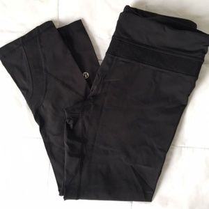 Lululemon size 6 black capris, lace inset at waist